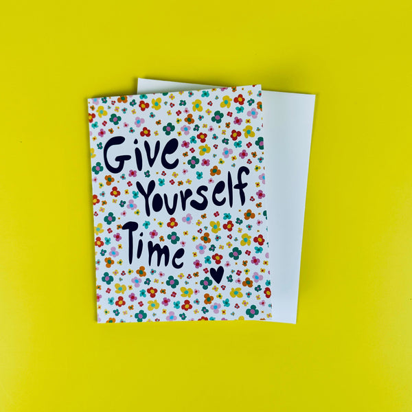 Greeting card with 'Give Yourself Time' text on a yellow background